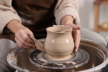 Hobby and craft. Woman making pottery indoors, closeup