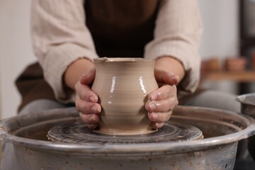 Hobby and craft. Woman making pottery indoors, closeup