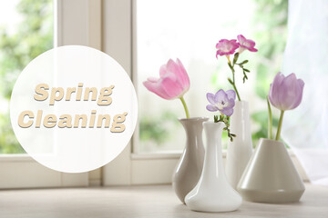 Spring cleaning. Beautiful flowers in vases on windowsill
