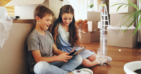 Kids, tablet and happy in new home with boxes, care and playful with online games, challenge and...