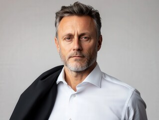 Fototapeta premium portrait of a confident businessman in a white shirt and black jacket