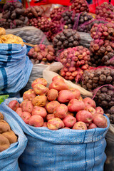 vertical colorful potatoes in a traditional market in la paz bolivia - gastronomy concept