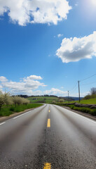 Fototapeta premium asphalt road panorama in countryside on sunny spring day, vibrant, with white tones