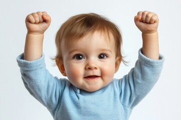 Powerful Infant with Pacifier Raising Arms in Triumph, Sporty Child Against a White Background