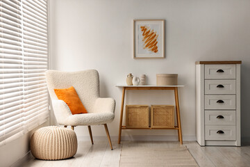Stylish room interior with console table near white wall