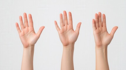 three hands raised in the air