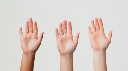 three raised hands on a white background