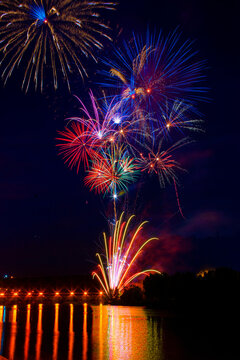 Colorful fireworks display over the Ebro River at night