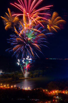Colorful fireworks display over the Ebro River at night