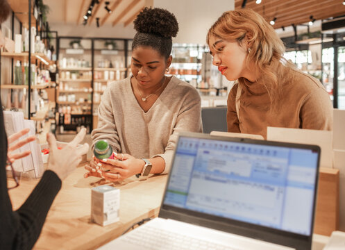 Women Consulting with a Specialist in a Cosmetics Store