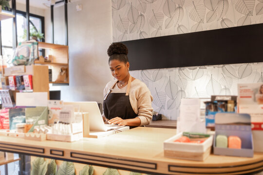 Employee at Cosmetics Store Managing Inventory and Sales