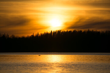 A scenic lake view in the forests of Finland in spring time