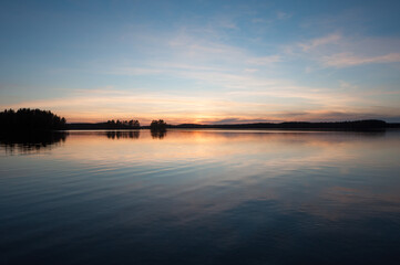 Fototapeta premium A scenic lake view in the forests of Finland in spring time