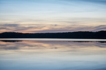 Fototapeta premium A calm, tranquil lake on a spring night in the forests of Finland