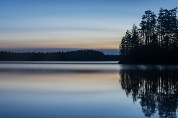 A calm, tranquil lake on a spring night in the forests of Finland