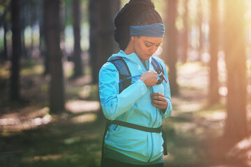 Fitness, hiking and jacket with woman in forest for adventure, wellness and explore guide....