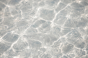 Cristal clear water with white marble texture at the beach at Holbox, Mexico 