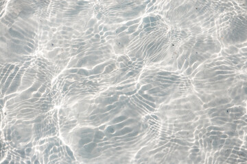 Cristal clear water with white marble texture at the beach at Holbox, Mexico 

