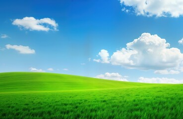 Obraz premium Vast green field stretches under vibrant blue sky. Fluffy white clouds drift across clear blue sky. Rolling hills suggest serene countryside landscape. Perfect for nature lovers, seeking images of