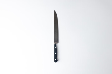 on white background on a table standard size steel straight kitchen knives with a black handle housewife set various accessories professional knives