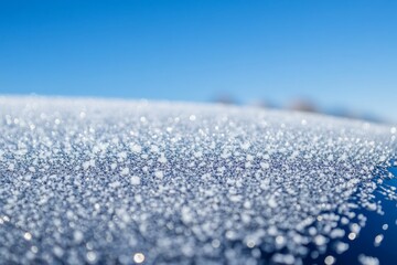 Obraz premium Close-up of frost crystals on surface sparkling in sunlight