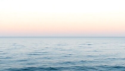 Obraz premium Serene Ocean Waters Under a Soft Pink Sky