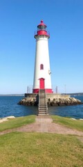 Historic Bug Light lighthouse overlooking Casco Bay in South Portland, Maine with clear blue skies, sunny, scenic, lighthouse