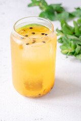 Waltzing Matilda cocktail with passion fruit, gin, and ginger ale in jar glass