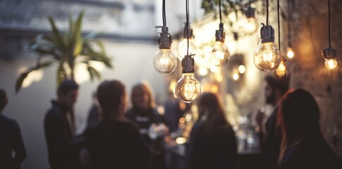 An intentionally blurry picture that highlights the dynamic atmosphere of a social occasion, complete with hanging lights and the enthusiastic attendees.