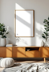 A white-framed mirror with a gold border hangs on a light gray wall, accompanied by two potted plants and a wooden cabinet with a white vase and a stack of books. A4 Frame Mockup