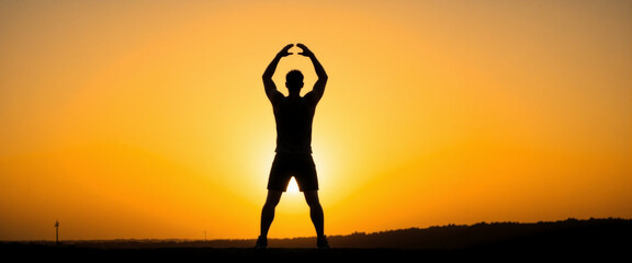Silhouette of a person stretching at sunrise, conveying a sense of peace and vitality, symbolizing the start of a new day against a vibrant orange background