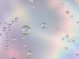 Iridescent macro background of oil drops on water, creating a mesmerizing rainbow effect, liquid, textures, luminescent