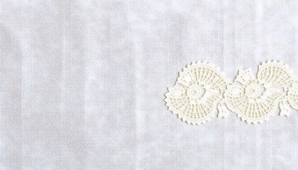 Delicate Cream Lace on Light Gray Fabric Background