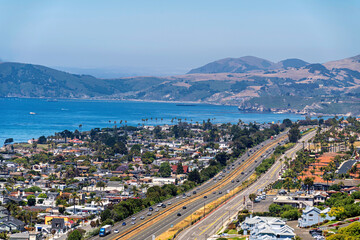 View of the city and highway, freeway with building, ocean, hills, sea, lake