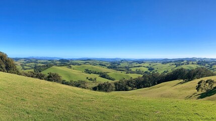 Obraz premium Serene Rolling Hills Under a Vast Blue Sky