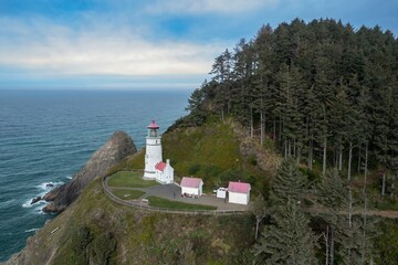 Aerial view of Heceta Head Lighthouse, Oregon, showcasing the iconic lighthouse, coastal scenery,...
