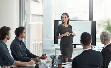 Presentation, meeting and pregnant business woman with team for feedback, finance statistics and review. Corporate, speaker and workers with graph for planning, company insights or growth in workshop