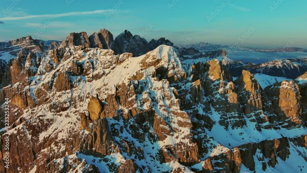 Wall mural aerial view of amazing rocky mountains in snow at sunrise, dolomites, italy, 4k