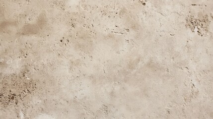 Close-up view of a light brown textured surface with various dark spots