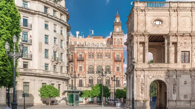 Morning timelapse of Central de Telefonica and the Town Hall in Plaza de San Francisco, Seville. Casa Consistorial, a masterpiece of Plateresque architecture with tram under a blue cloudy sky