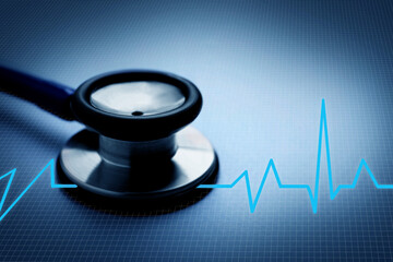 Stethoscope and heartbeat line on blue gradient background, closeup. Healthcare concept