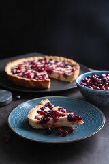 Piece of delicious currant pie and fresh berries on grey table, space for text