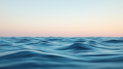 Obraz premium Gentle Waves on Calm Water at Soft Sunset Light Over Horizon