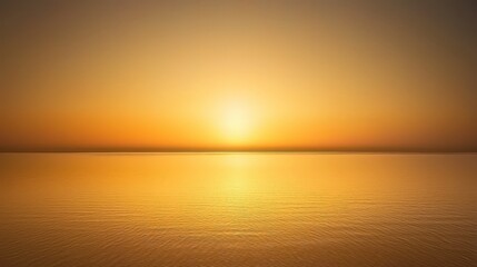 Obraz premium Serene Golden Sunrise Over Calm Water with Gentle Waves