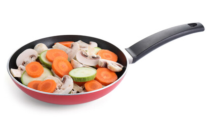 Frying pan with fresh vegetables and mushrooms isolated on white