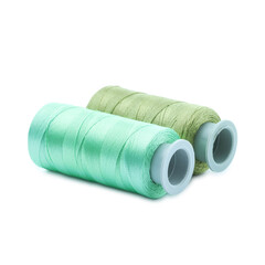 Spools of colorful sewing threads isolated on white