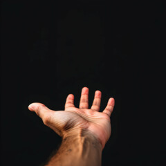 Fototapeta premium Outstretched Hand Reaching Towards a Dark Background Evoking Themes of Vulnerability and Connection