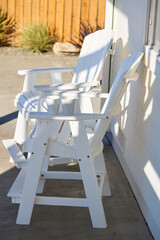 White Adirondack Chairs with Mugs on Patio