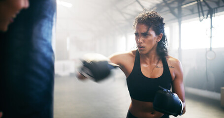 Sports, kickboxing and woman in gym for training, challenge or competition with strength. Fitness,...