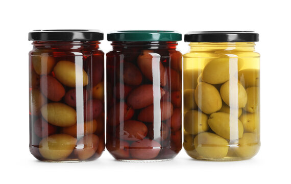 Pickled olives in glass jars isolated on white